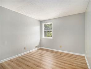 unfurnished room with light hardwood / wood-style flooring