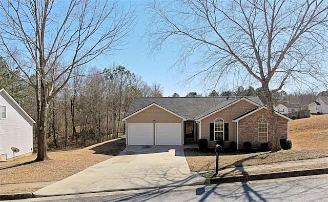 ranch-style house featuring concrete driveway, stone siding, and an attached garage