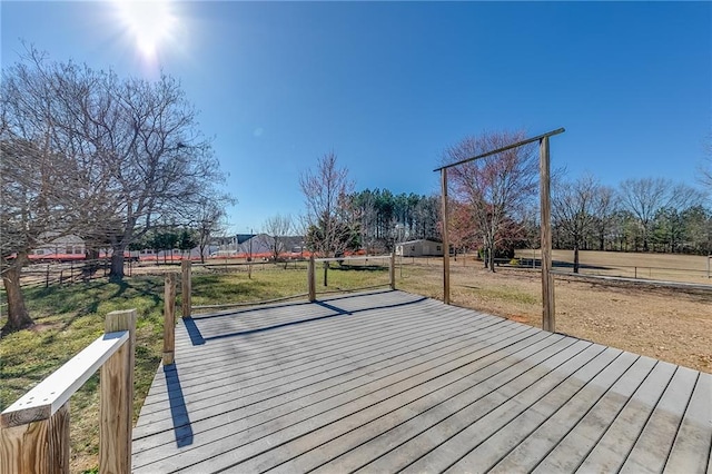 wooden deck featuring fence and a yard