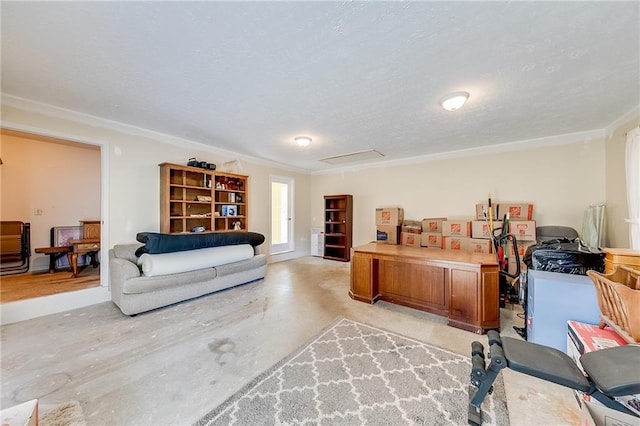 home office with attic access, concrete floors, and a textured ceiling