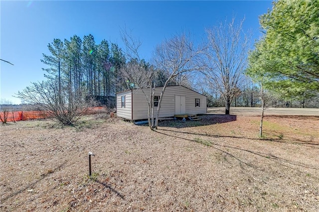 view of home's exterior featuring an outbuilding