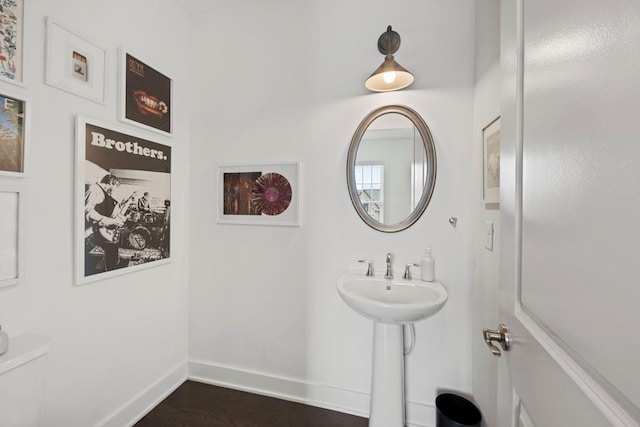 bathroom featuring toilet and hardwood / wood-style floors