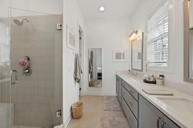 bathroom with tile patterned flooring, vanity, and an enclosed shower