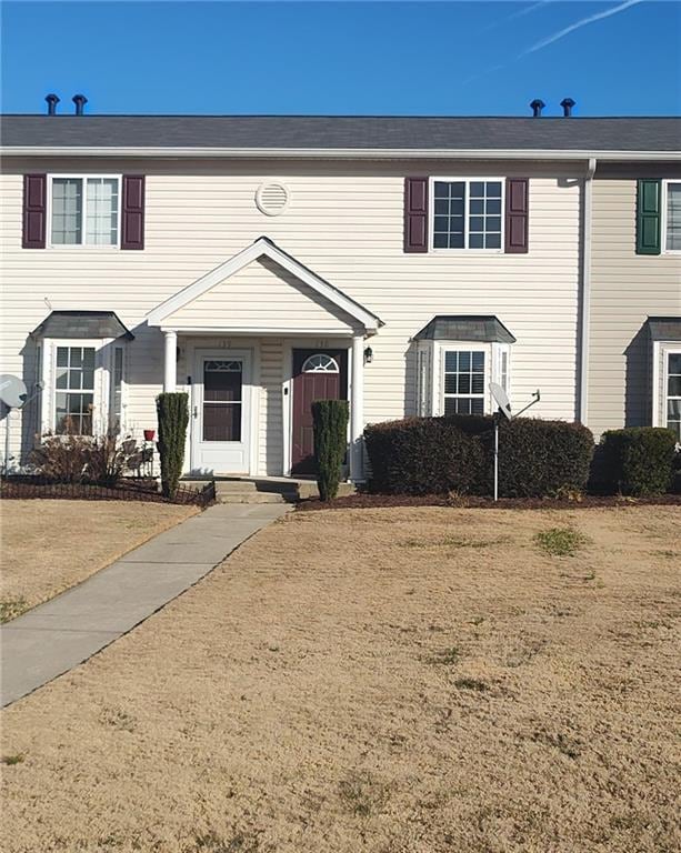 view of front of house with a front lawn