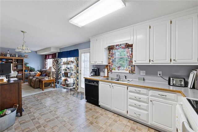 kitchen with dishwasher, sink, hanging light fixtures, white cabinets, and white stove