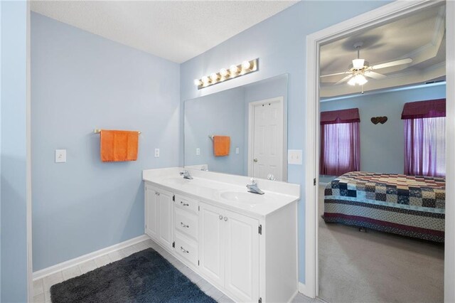 bathroom featuring ceiling fan and vanity