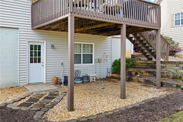 entrance to property featuring a wooden deck