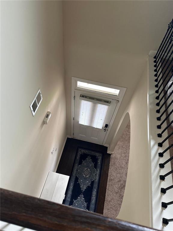 1749 Misselthrush Ln, Mcdonough, GA 30253 - carpeted foyer featuring arched walkways