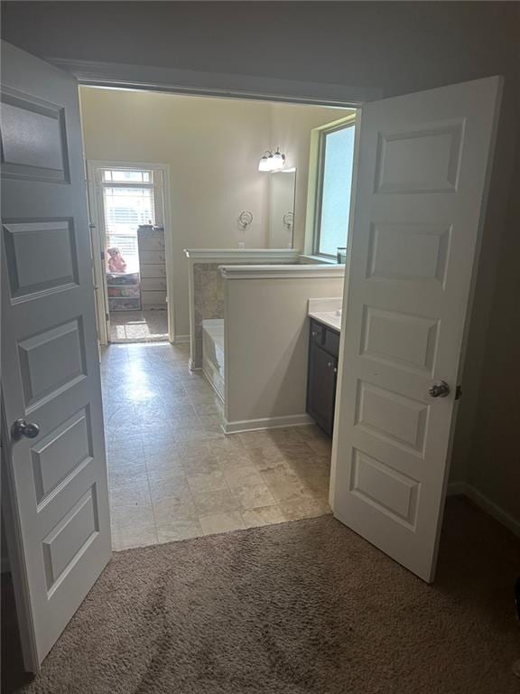 1749 Misselthrush Ln, Mcdonough, GA 30253 - hall featuring baseboards, an upstairs landing, and light carpet