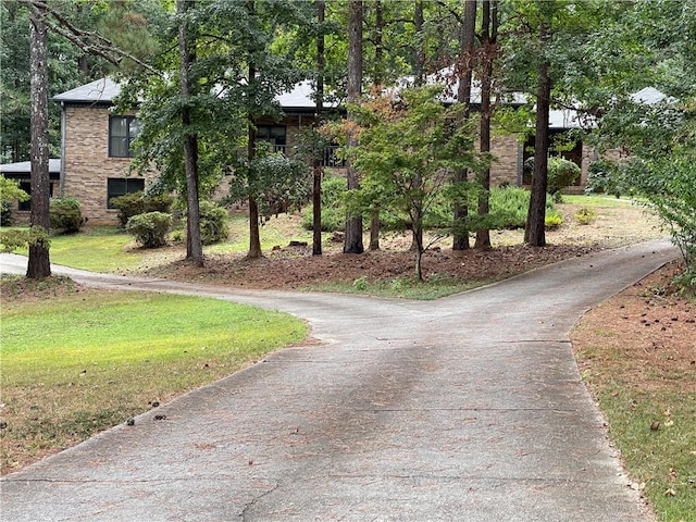 view of home's community with a lawn