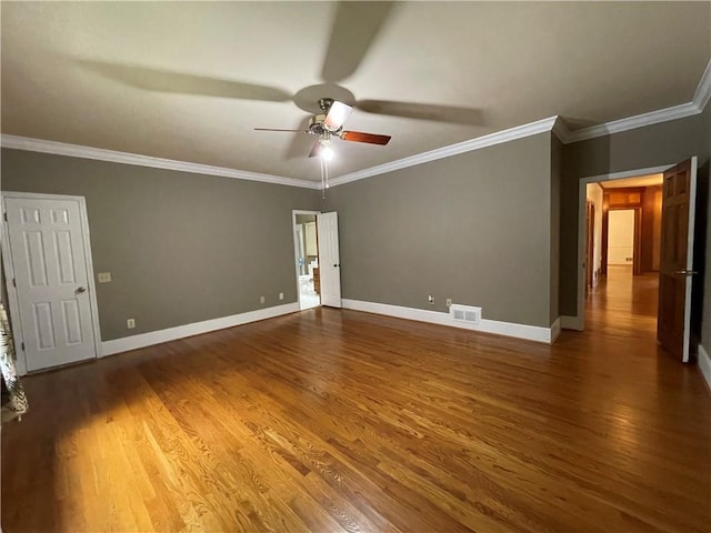 spare room featuring crown molding, ceiling fan, and hardwood / wood-style flooring