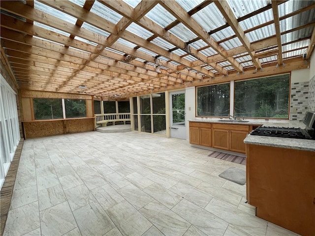 unfurnished sunroom featuring sink