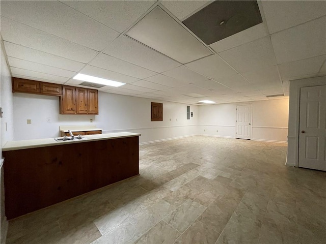 kitchen with a drop ceiling and sink