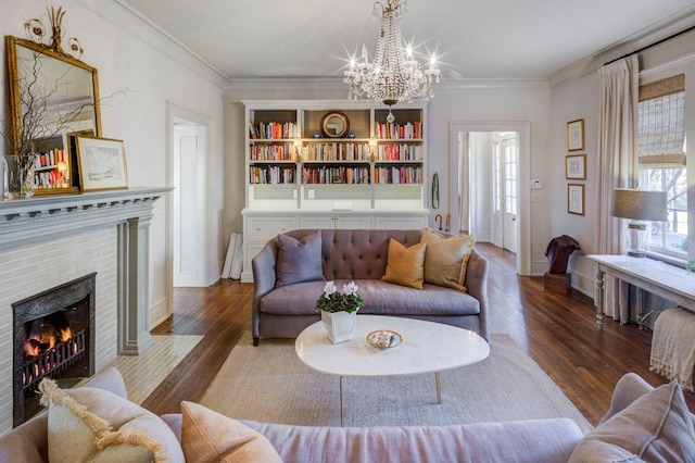 living room with an inviting chandelier, wood finished floors, and a healthy amount of sunlight
