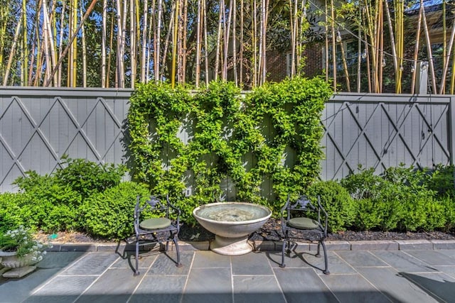 view of patio featuring fence