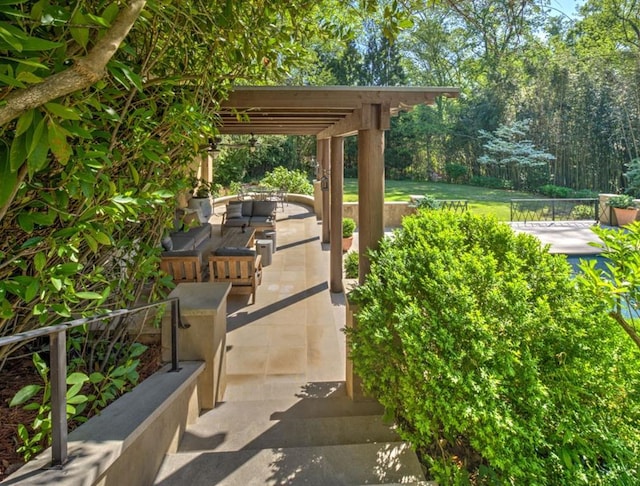 view of patio featuring a pergola and fence