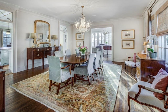 dining room with plenty of natural light, a notable chandelier, and ornamental molding
