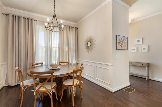 dining room with dark wood-type flooring, crown molding, a chandelier, and visible vents