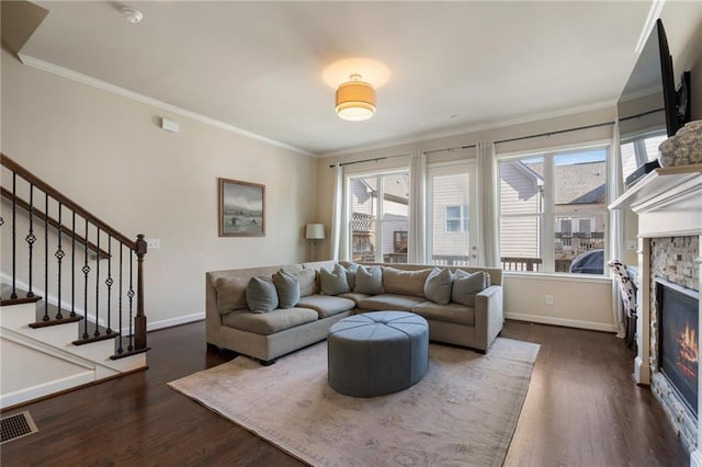 living room featuring baseboards, dark wood finished floors, and visible vents