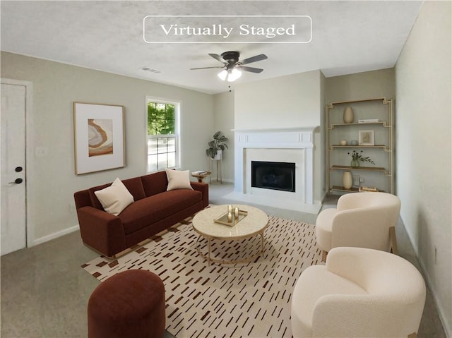 carpeted living room featuring ceiling fan