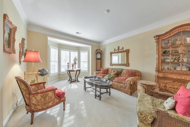 living area featuring visible vents, carpet flooring, crown molding, and baseboards