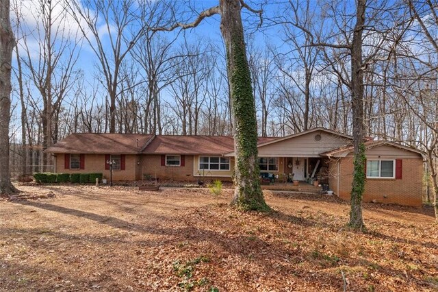 ranch-style home featuring a porch