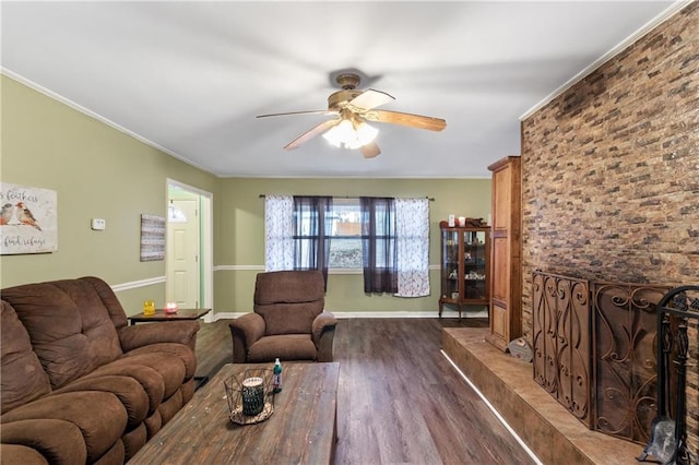 living room with ornamental molding, dark hardwood / wood-style floors, and ceiling fan