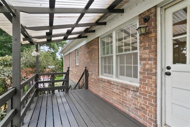 wooden terrace with a pergola