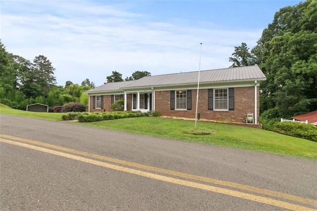 ranch-style home with a front lawn