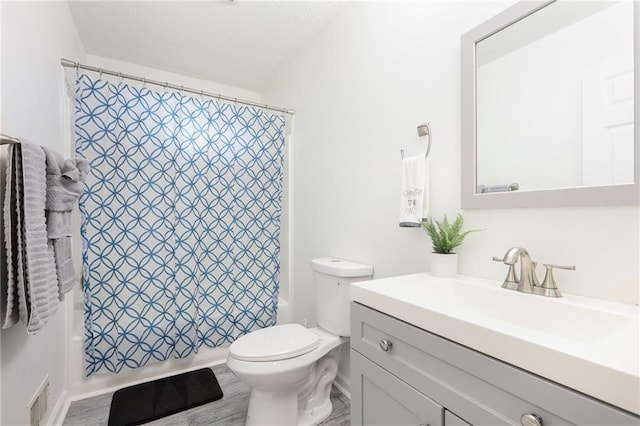 bathroom featuring visible vents, wood finished floors, vanity, toilet, and shower / bathtub combination with curtain