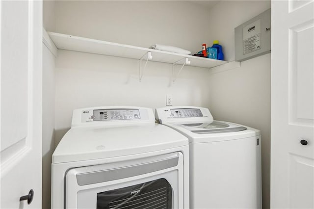 washroom with laundry area and washer and dryer