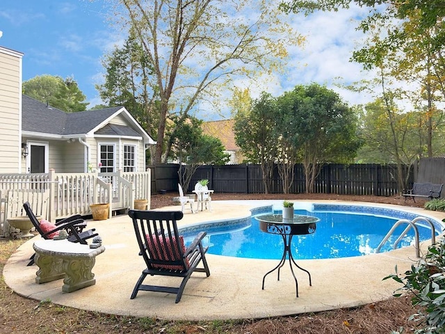 view of pool with a fenced in pool, a fenced backyard, and a patio area