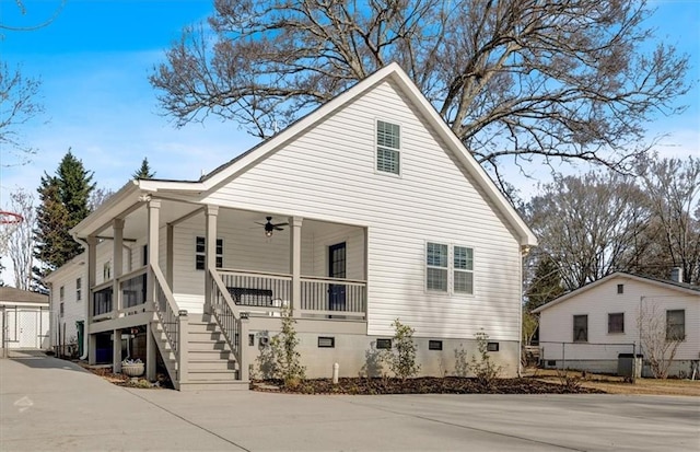 view of home's exterior featuring central AC unit, ceiling fan, and a porch