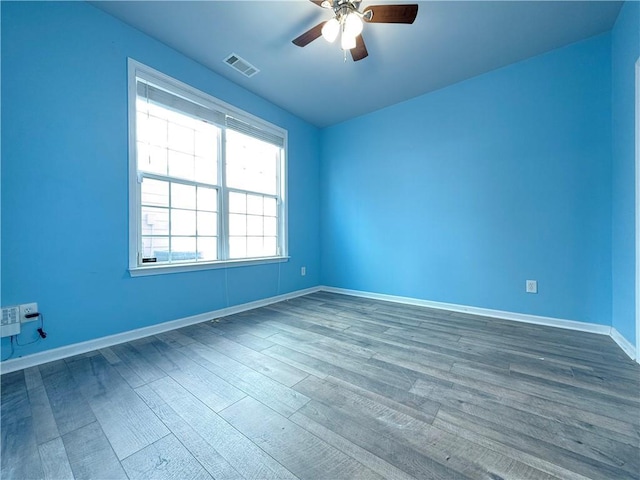 unfurnished room featuring hardwood / wood-style floors and ceiling fan