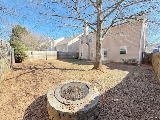 view of yard with a fire pit