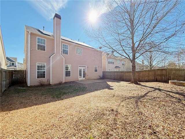 rear view of property with a patio and french doors