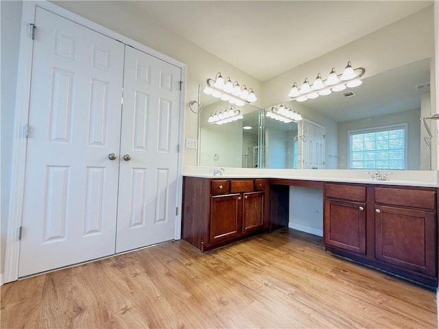 bathroom featuring hardwood / wood-style flooring and vanity