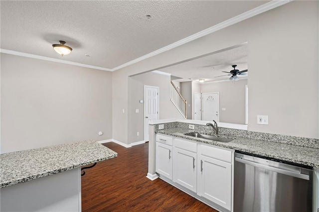 kitchen with light stone countertops, dark wood-style flooring, a sink, white cabinets, and dishwasher