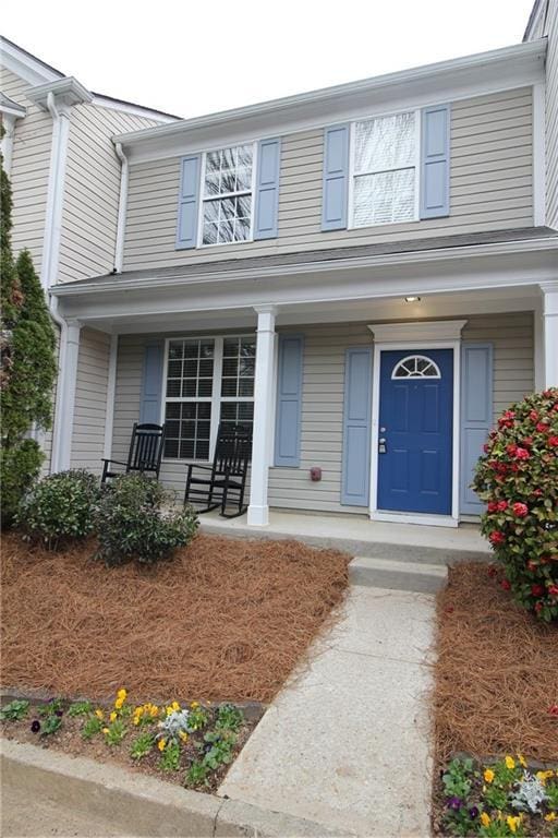 doorway to property featuring a porch