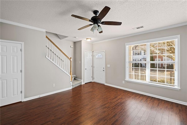 entrance foyer featuring visible vents, crown molding, stairs, and wood finished floors