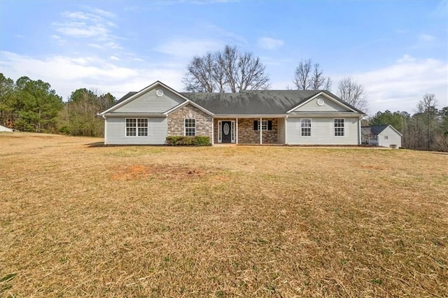 ranch-style home with stone siding and a front yard