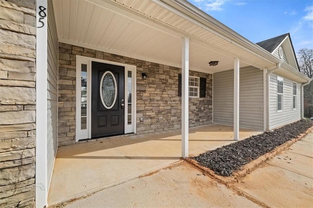 view of exterior entry with stone siding