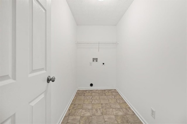 laundry room featuring hookup for a washing machine, baseboards, hookup for an electric dryer, laundry area, and a textured ceiling