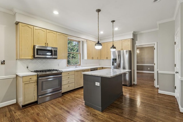 kitchen featuring pendant lighting, appliances with stainless steel finishes, dark hardwood / wood-style flooring, and a center island