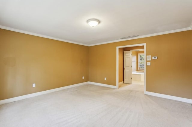 carpeted spare room featuring ornamental molding