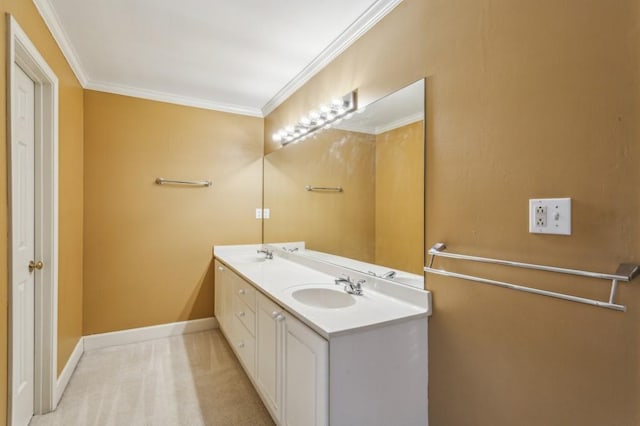 bathroom with ornamental molding and vanity