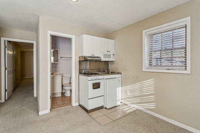 kitchen featuring white cabinetry, sink, light colored carpet, and white appliances