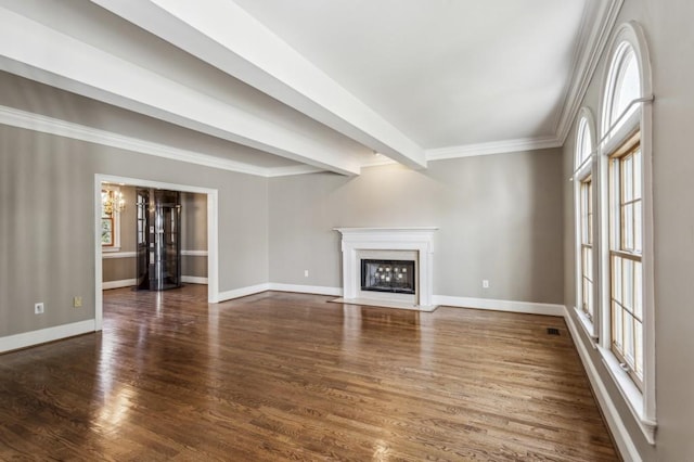 unfurnished living room with dark hardwood / wood-style flooring, crown molding, a chandelier, and beamed ceiling