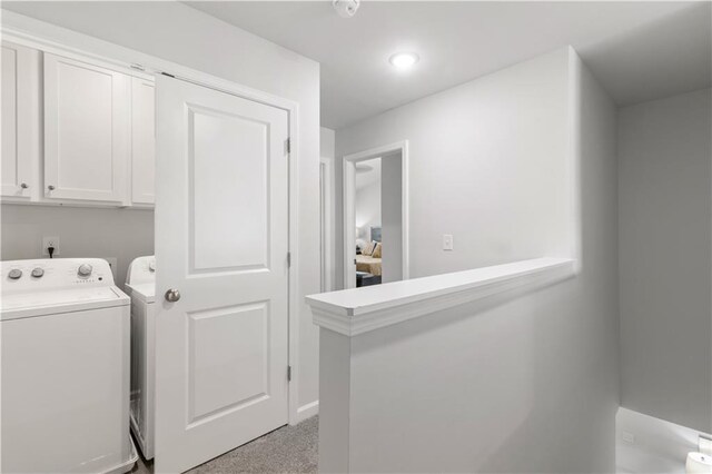 laundry room with cabinets and washing machine and dryer