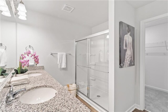 bathroom with vanity and an enclosed shower